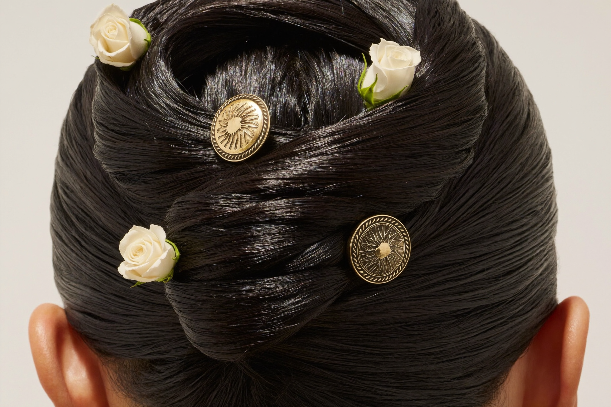 Twisted chignon detail with gold pins