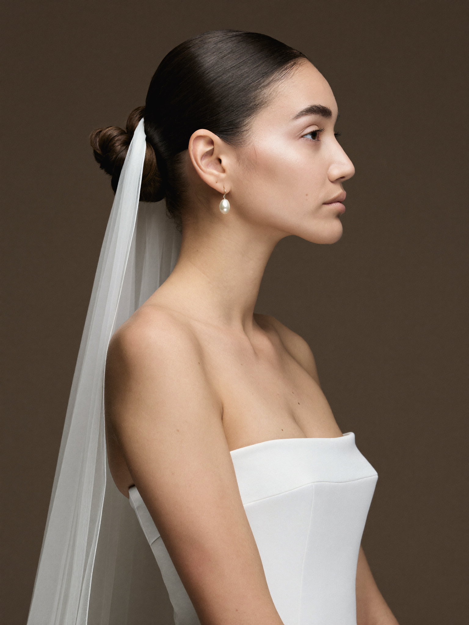 Sleek modern sculptural low bun